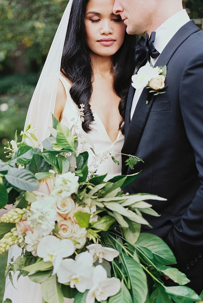 Modern bouquet with cascade orchids.
