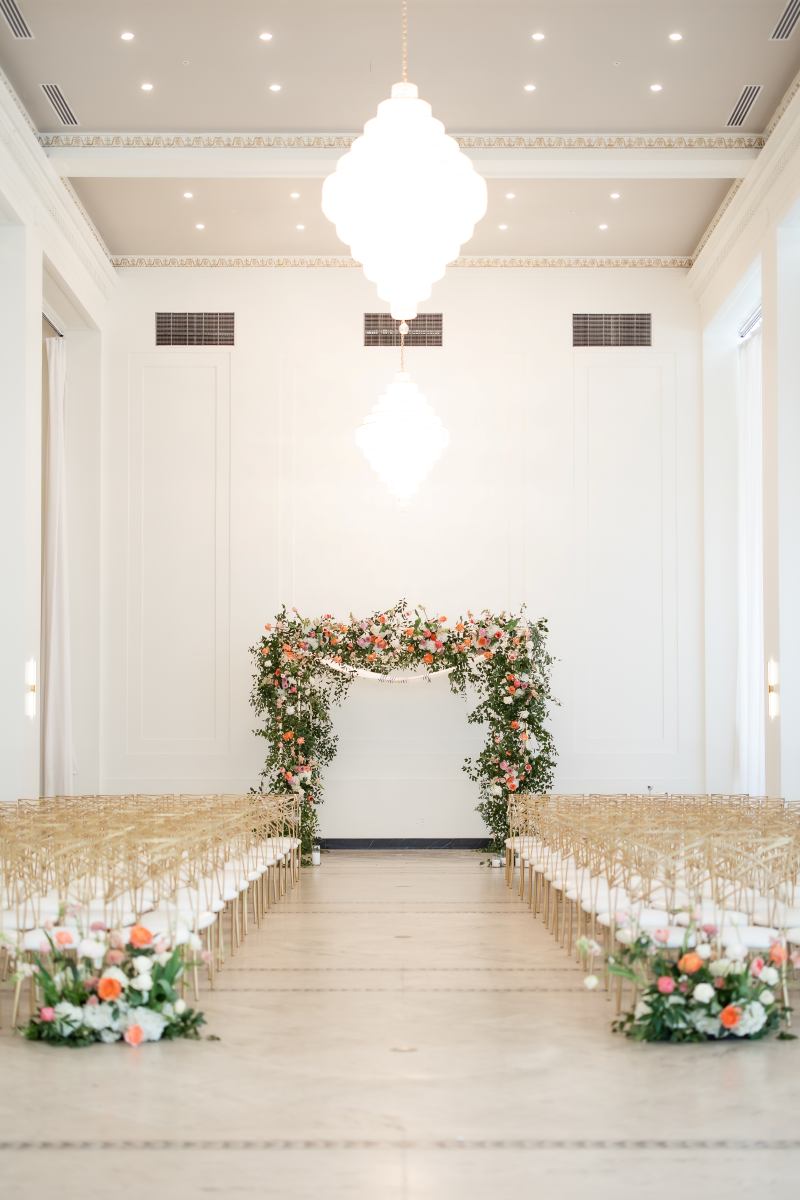 Rochester Wedding Florist | Arbor Midtown wedding ceremony with a large floral chuppah and floor pieces.