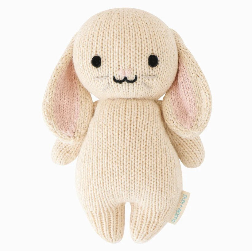 Cuddle + Kind | Baby Bunny hand knit plush in an oatmeal color.