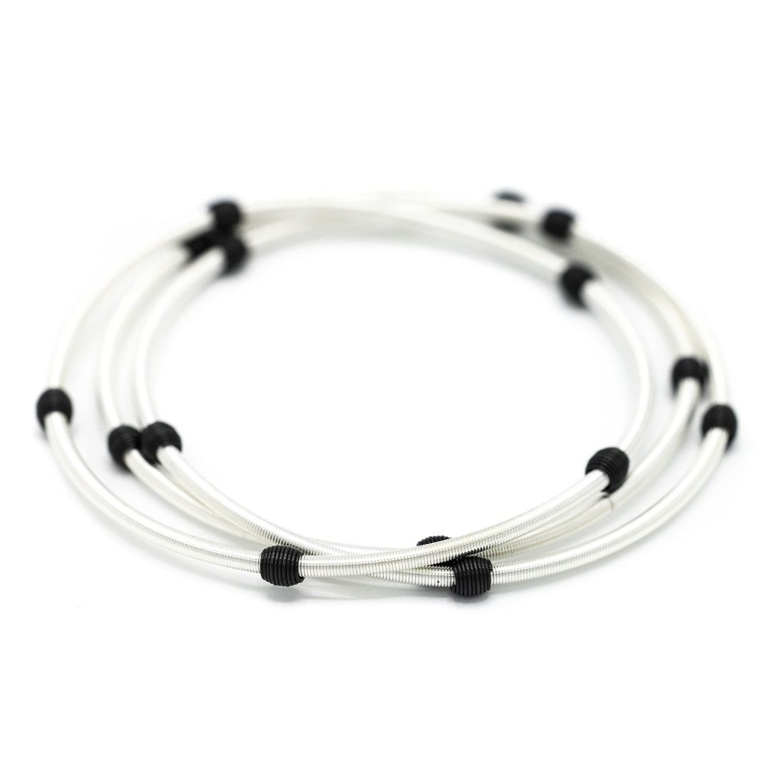 EMERSON & OLIVER | silver bracelets with black beads.