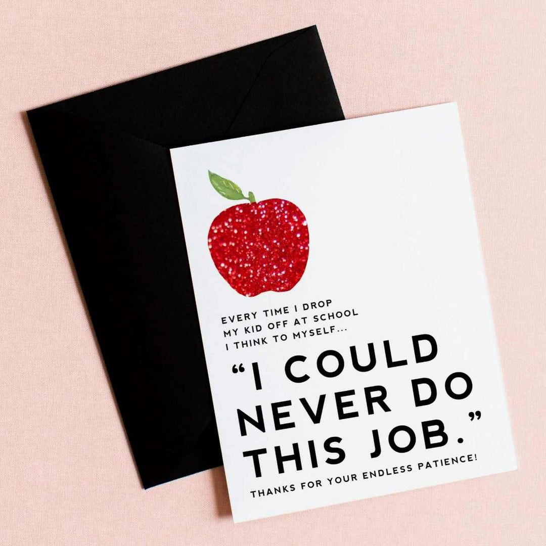 A white card with a sparkly apple illustration and text that reads "everytime I drop my kid off at school I think to myself "I could never do this job." Thanks for your endless patience!".