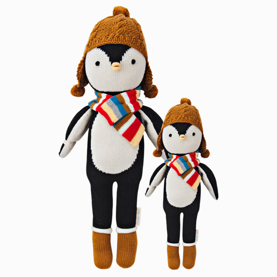 Everest the Penguin | A black and white penguin with a multi color scarf, brown hat, and brown boots. Two sizes shown, 20" and 13".
