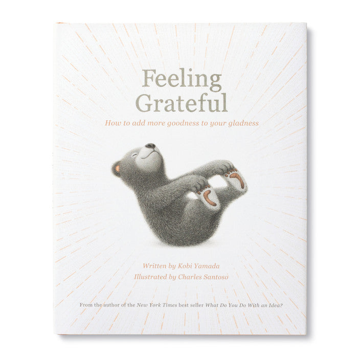 Feeling Grateful: How to add more goodness to your gladness | A white book with an illustrated bear that is rocking holding his toes in his hands. From the author of the New York Times best seller "What Do You Do With an Idea?."