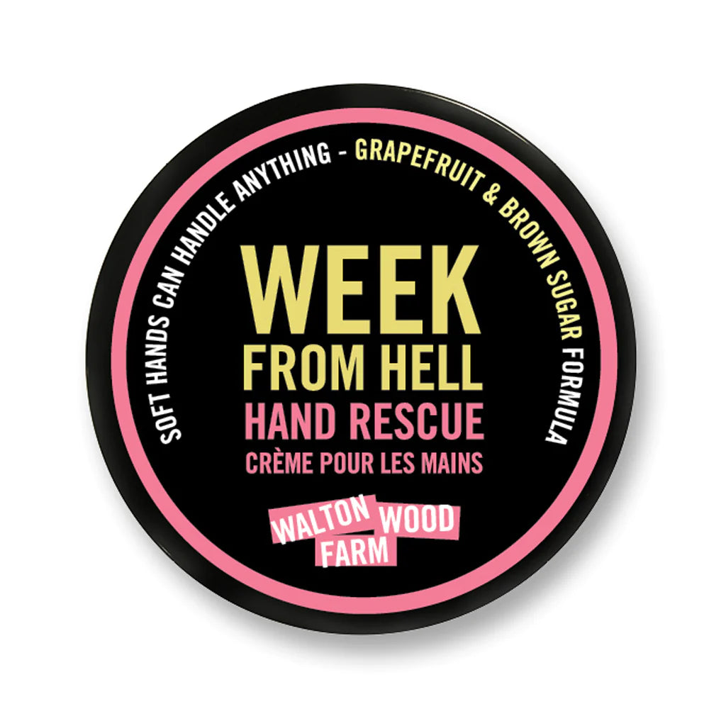 Week From Hell Hand Rescue | Walton Wood Farm | A round black container that reads " Soft Hands Can Handle Anything - grapefruit & brown sugar formula. Week From Hell Hand Rescue, creme pour les mains, Walton Wood Farm." in pink, white, and yellow.