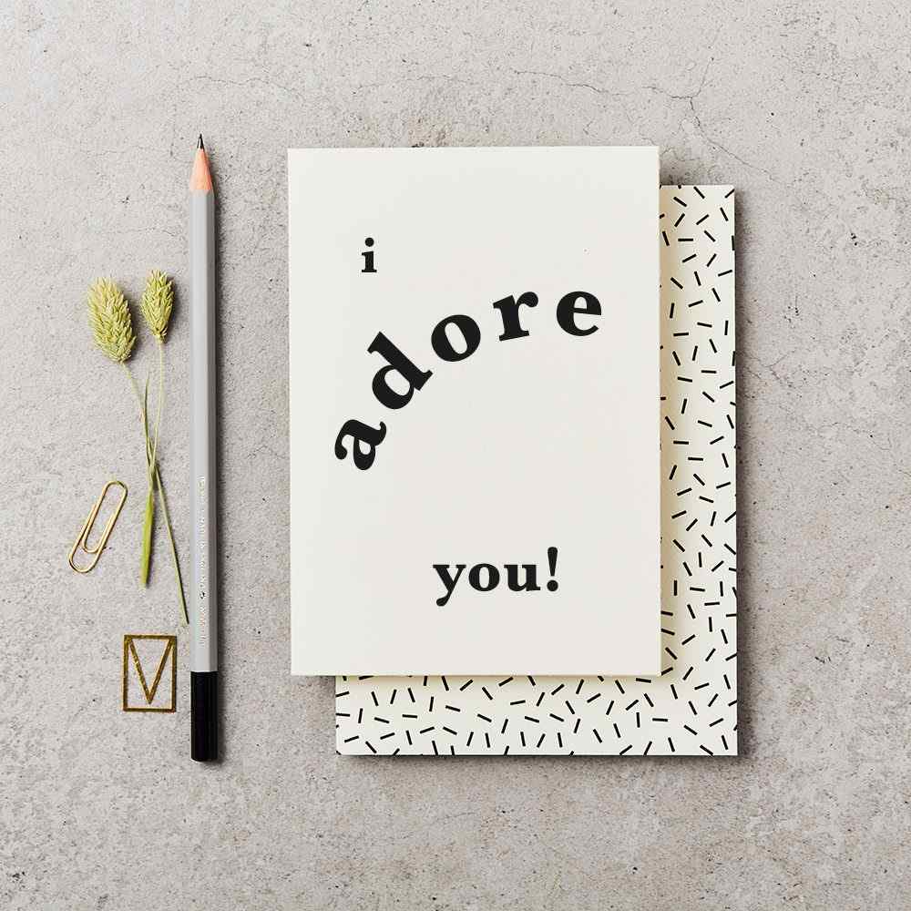 Katie Leamon "I Adore You!" Greeting Card | hite with bold text and a decorated envelope.