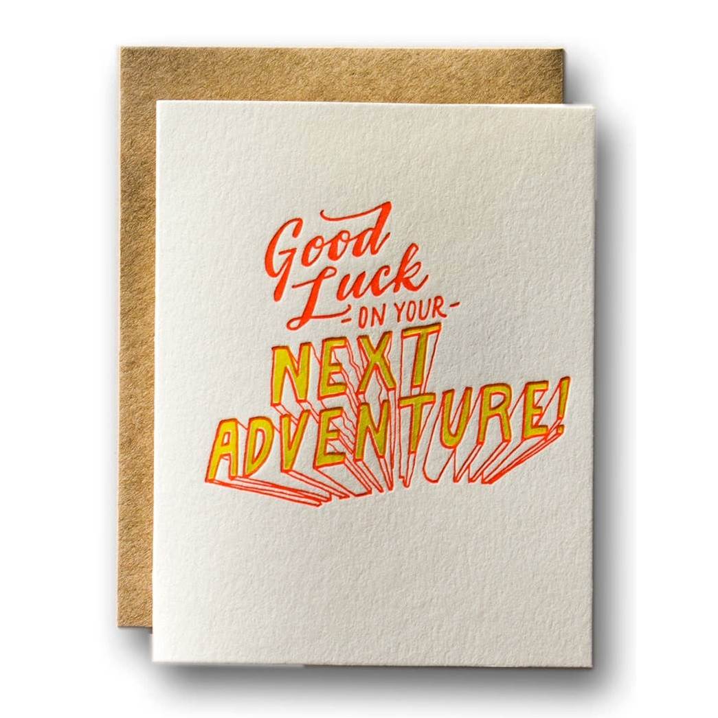 Ladyingers Press | "Good luck on your next adventure" | A white card with orange and yellow text.