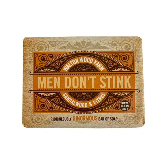 A rustic patterned package with " Men Don't Stink, Walton Wood Farm, Sandalwood & Citrus. Net Wt 10.5 oz/300g, Ridiculously Ginormous Bar Of Soap".