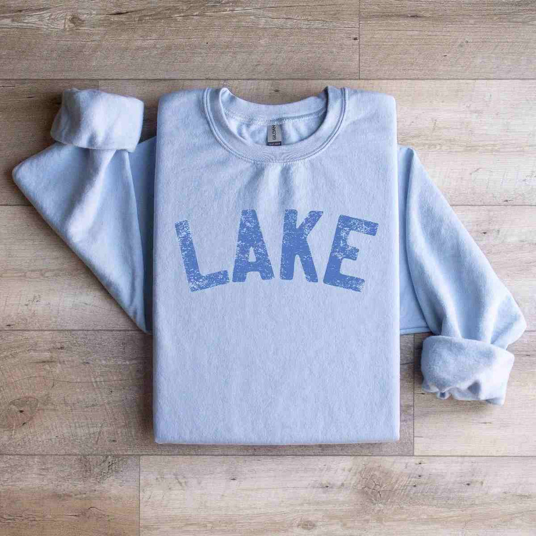 Mugsby | Lake Crewneck Sweatshirt | A blue sweatshirt with blue text.