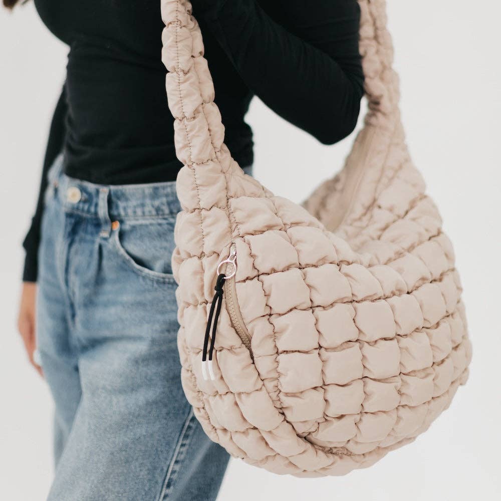 Pretty Simple | Carmen Quilted Hobo Tote Bag: Tan | Close up on the bag showing a top zipper and and side zipper.