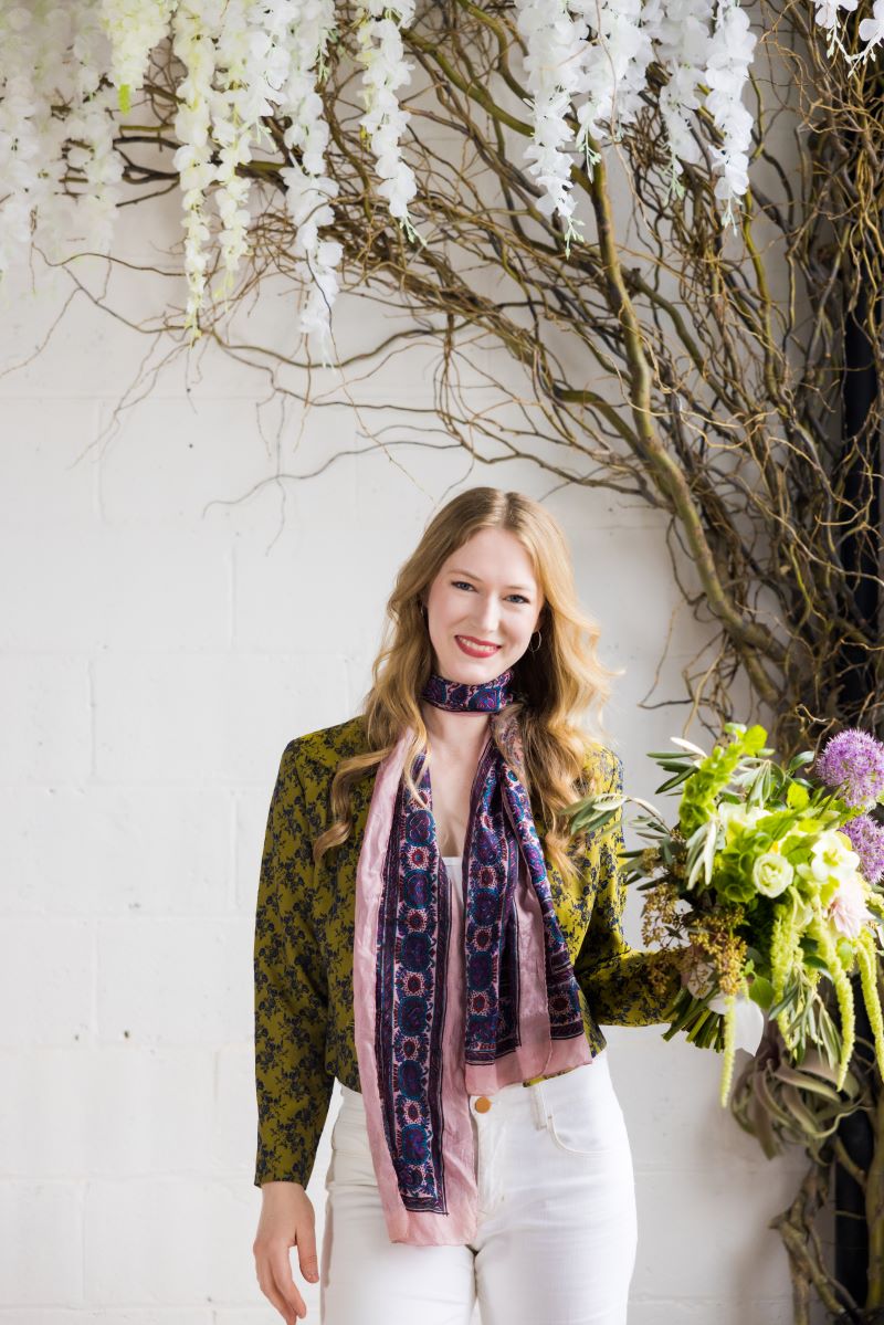 Cecily head shot holding flowers