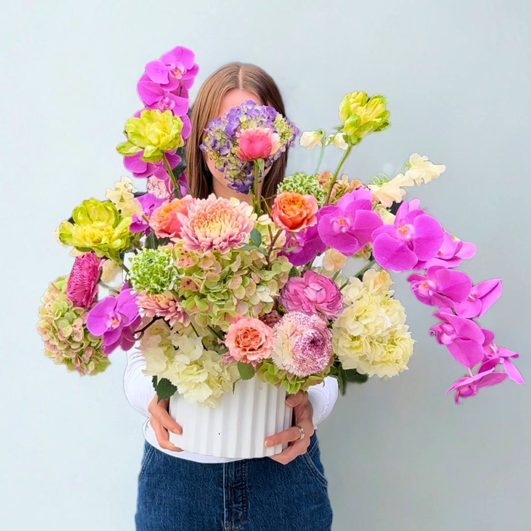 Stacy K Floral | Ethereal Blooms | A large floral arrangement with a variety of blooms such as orchids, hydrangea, roses, and more.
