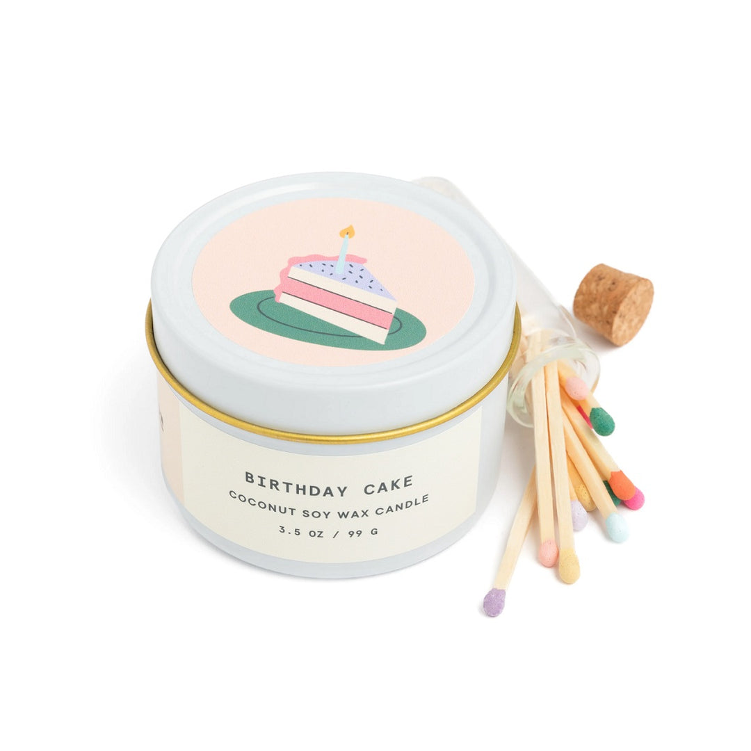 Birthday Cake Tin Candle & Match Set | A Candle in a birthday themed tin. Cake illustration on the lid. Comes with multicolored matches in a small glass bottle. The candle reads Birthday Cake, coconut soy wax candle, 3.5 oz / G