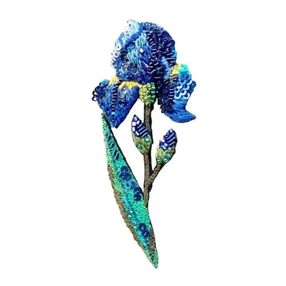 Wild Iris Brooch | Trovelore | A blue iris with a green stem and yellow accents, handmade, embroidered, and beaded brooch.