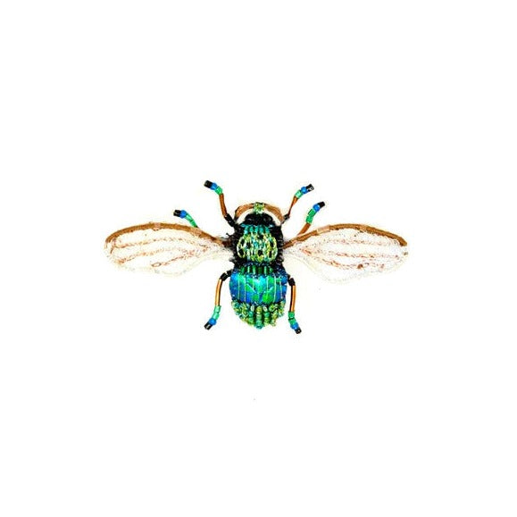 Field Be Brooch | Trovelore | A hand embroidered Field Bee brooch with tiny details, white wings, and black, green, blue body.