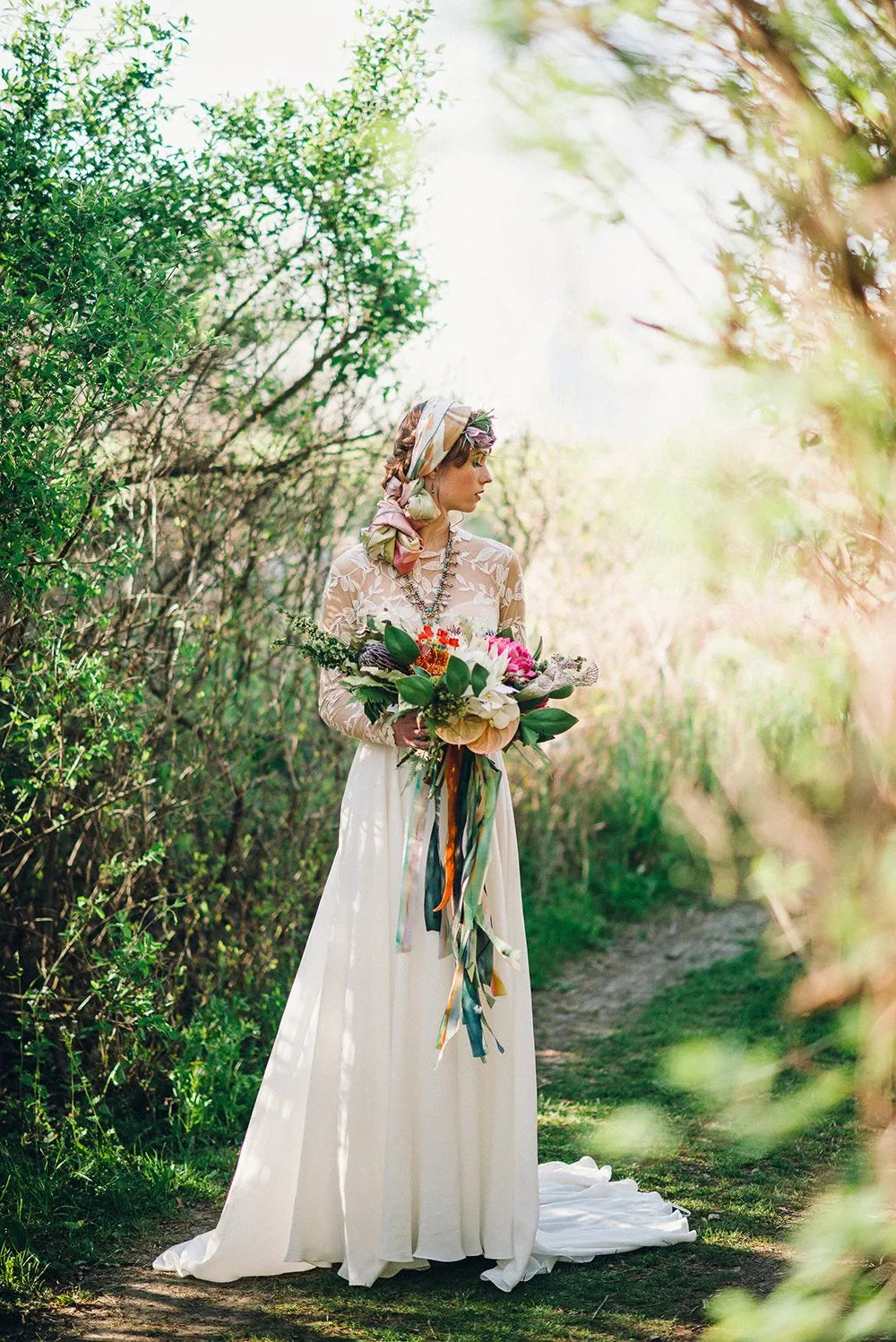 Bride at firelights camps with protea bouquet