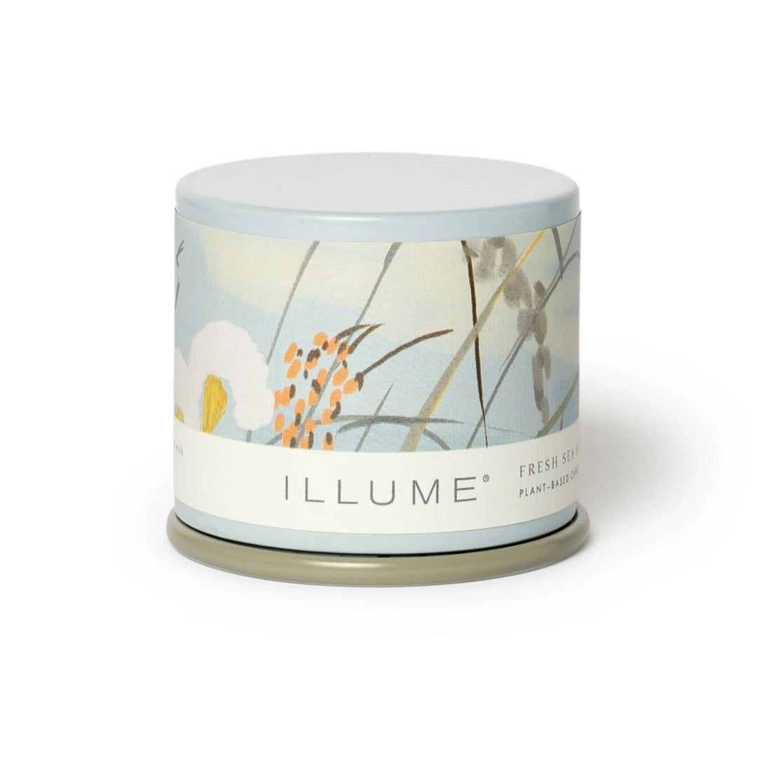 Demi Vanity Candle | Illume | A light blue tin with a beach floral patterned label.
