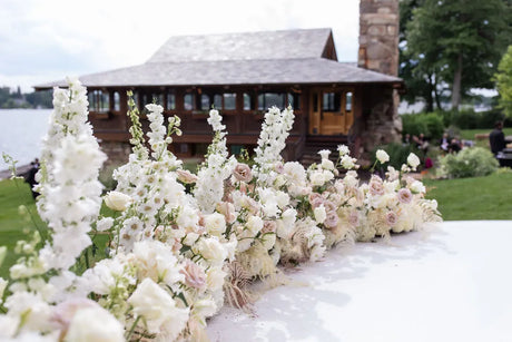 WHITE FLORAL LINED WEDDING AISLE