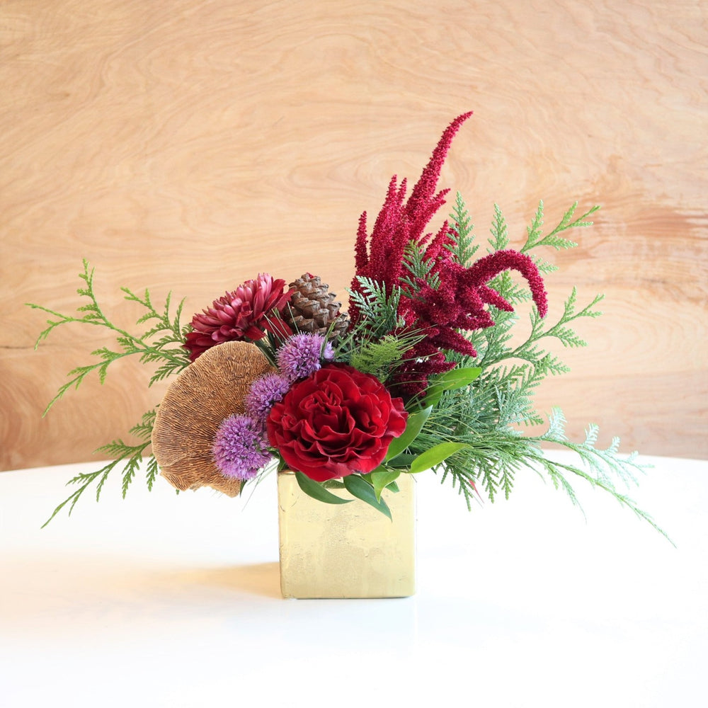 Frost | Vased Arrangement | Photo of the arrangement against a wooden background.