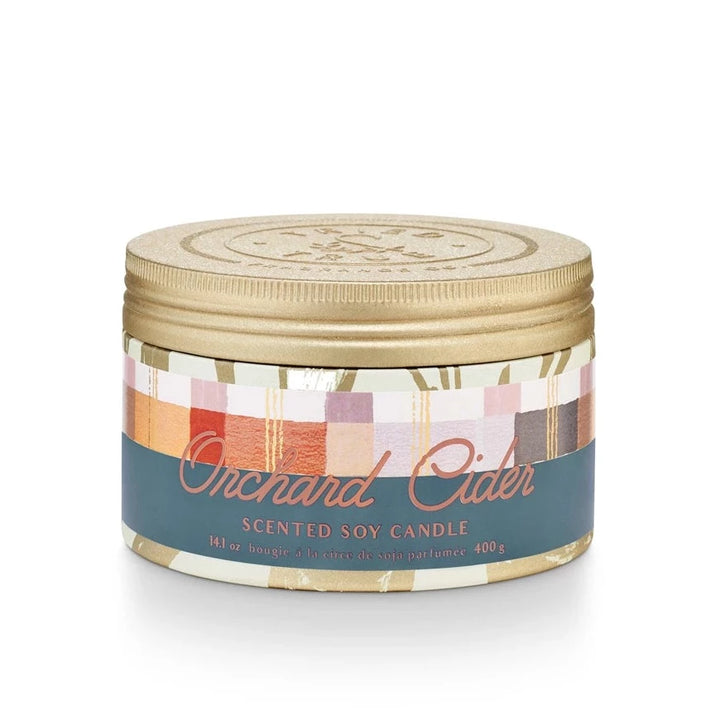 Tried & True Large Tin Candle | Orchard Cider | A gold patterned tin with a blue, orange, red, yellow, and lavender label that reads "Orchard Cider, Scented Soy Candle, 14.1 oz, bougie, a la circe de soja parfumee, 400g. ".