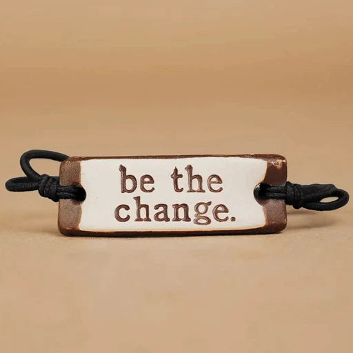 MudLOVE Original Bracelet | "be the change" ceramic piece with an elastic cord.