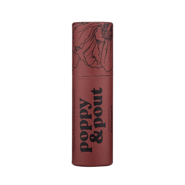 Poppy & Pout Lip Balm | A red lip balm stick with trendy black line illustration and text that reads "Poppy & Pout Cinnamint".