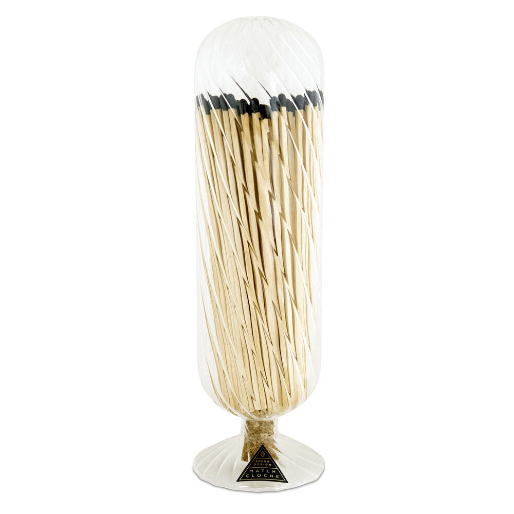 Skeem Helix Glass Fireplace Match Cloche | Clear glass match cloche with a helix spiral pattern and cork holding in matches. The matches are wooden with a black striking head.