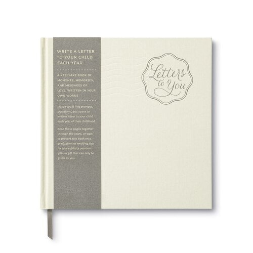 "Letters to You" Journal - An ivory cream cover that has a stamp style title that reads "Letters to You" and a label that starts "Write a letter to your child each year". Has a bookmark ribbon.