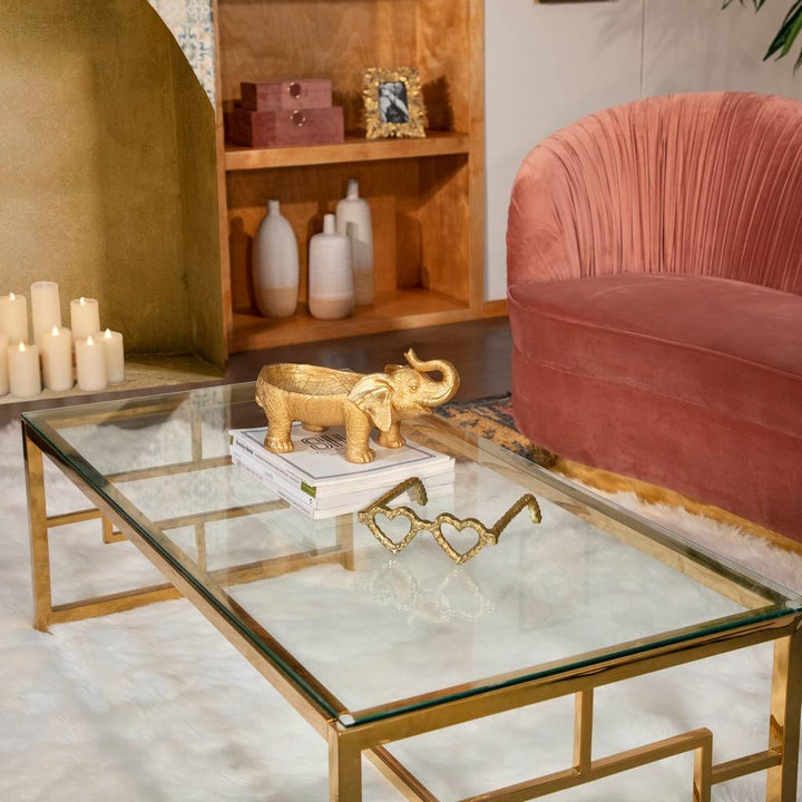 Metal Heart Shaped Glasses | Glasses placed on a glass topped table in a living room.