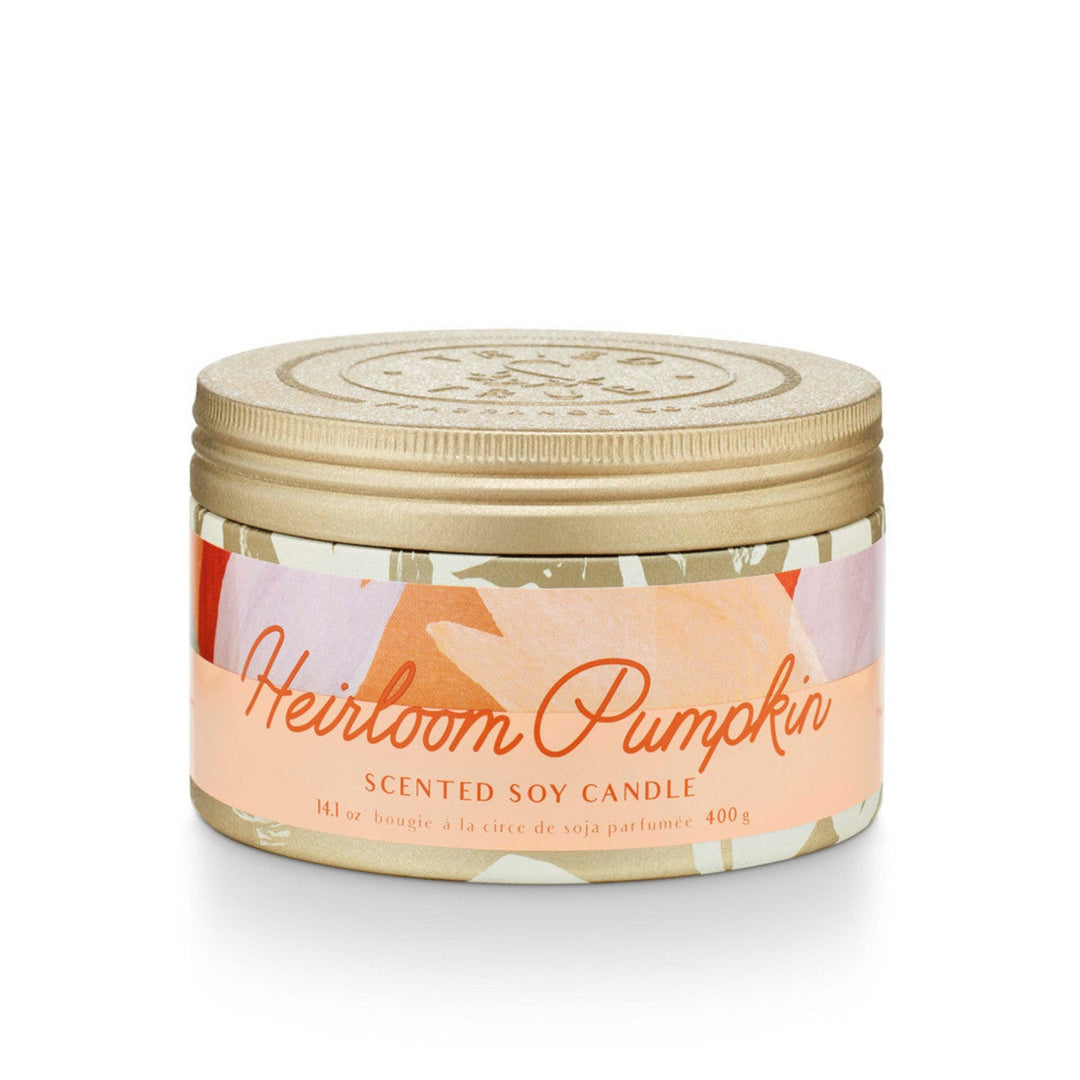 Heirloom Pumpkin Scented soy candle, 14.1 oz, 400 g. Candle with gold lid, and red, orange, and lavender colored patterned label.