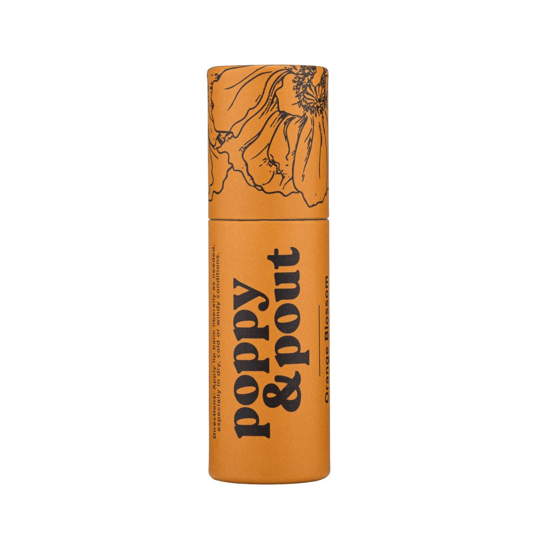 Poppy and Pout Lip Balm | Orange Blossom lip balm in an ecofriendly container. Package is orange with a floral design on the lid.