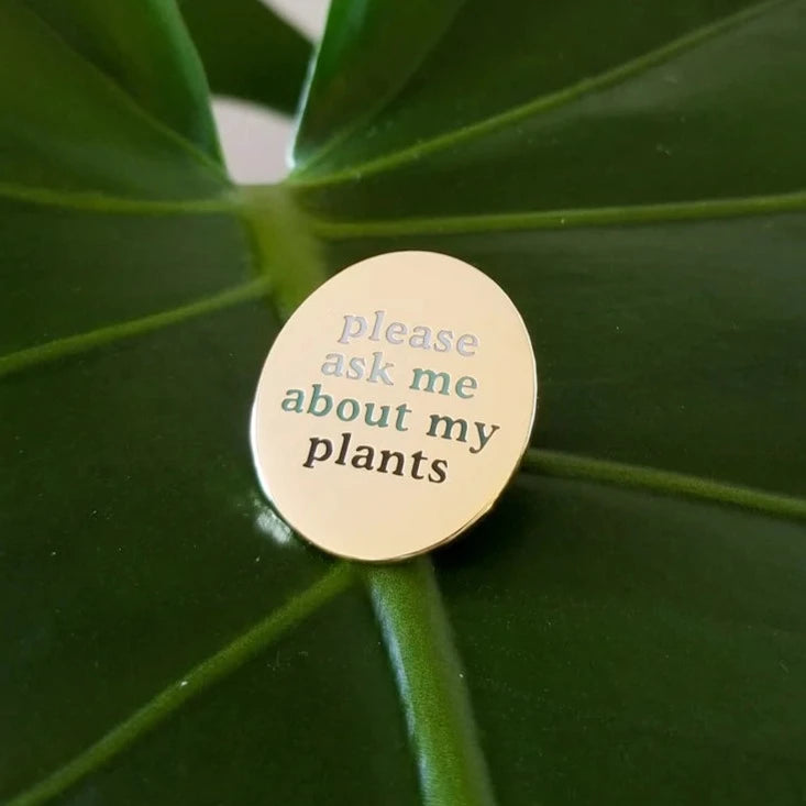 Hemleva Enamel Pins | gold "please ask me about my plants" pin with lettering in a white to dark green gradient.