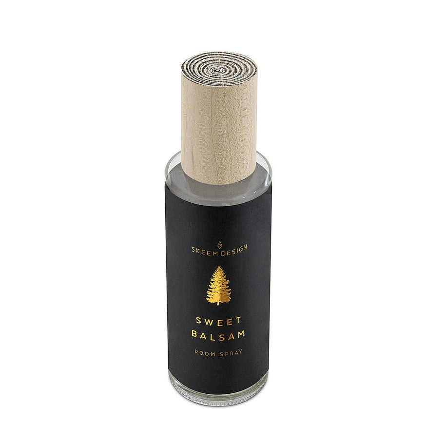 Skeem Sweet Balsam Room Spray | A black label with a tree and text that reads "Skeem Design, Sweet Balsam, Room Spray". Text is gold. The lid is natural wood with a spiral pattern on top.