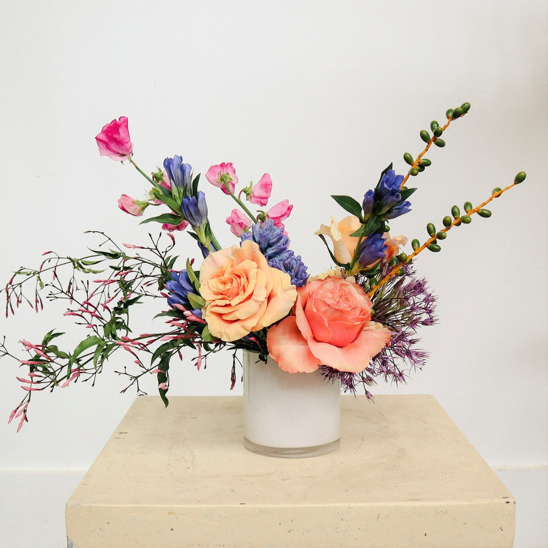 Summer Solstice | A bright colored arrangement with pinks, pastels, and accent greenery.