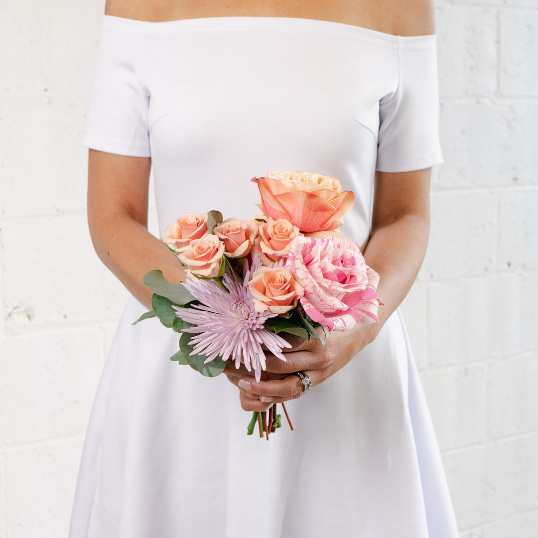 coral, pink and lavender tussy mussy wedding florist
