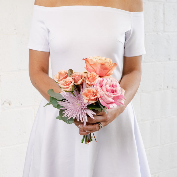 coral, pink and lavender tussy mussy wedding florist