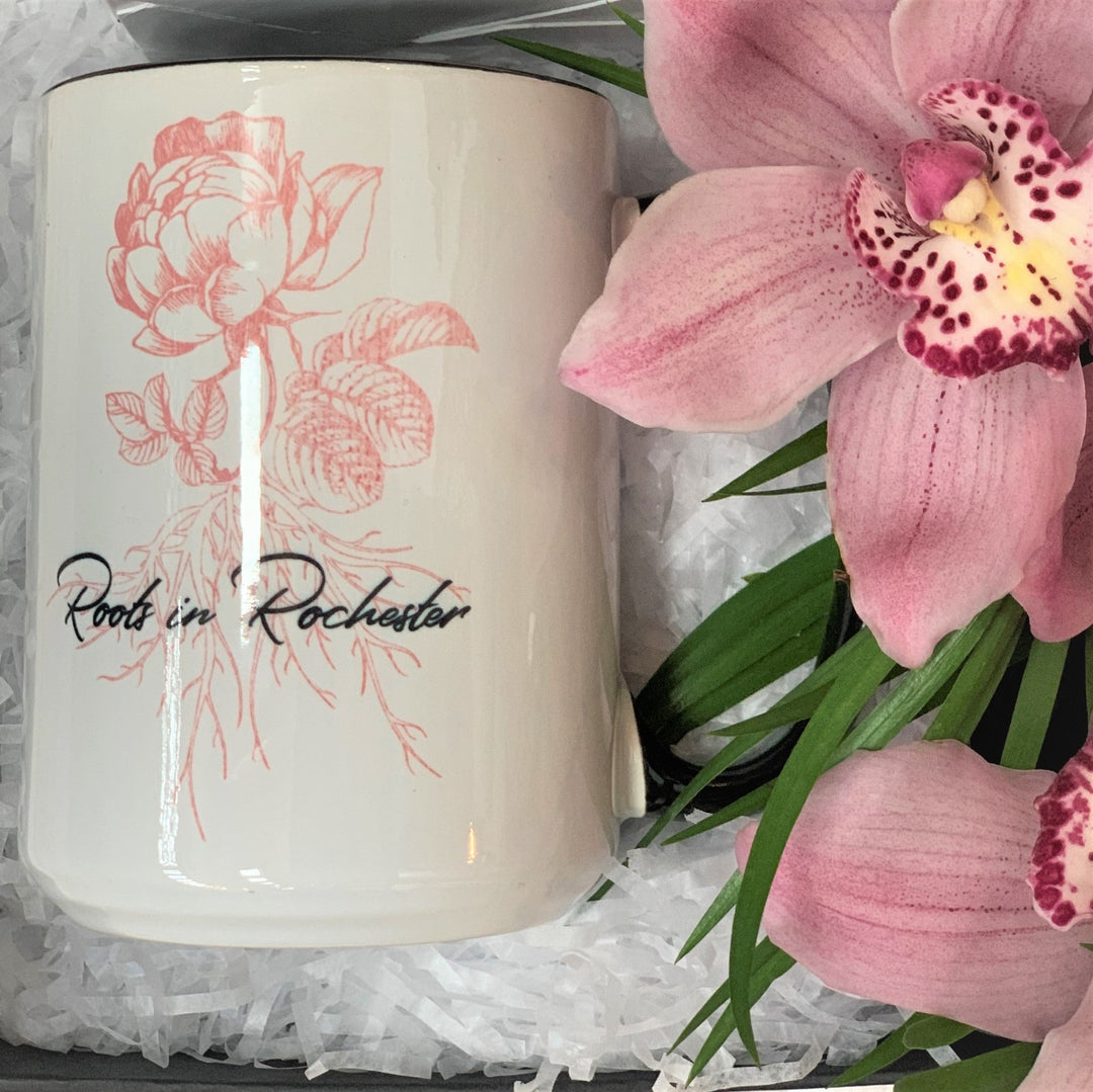 Close up of Roots in Rochester mug and fresh orchids.