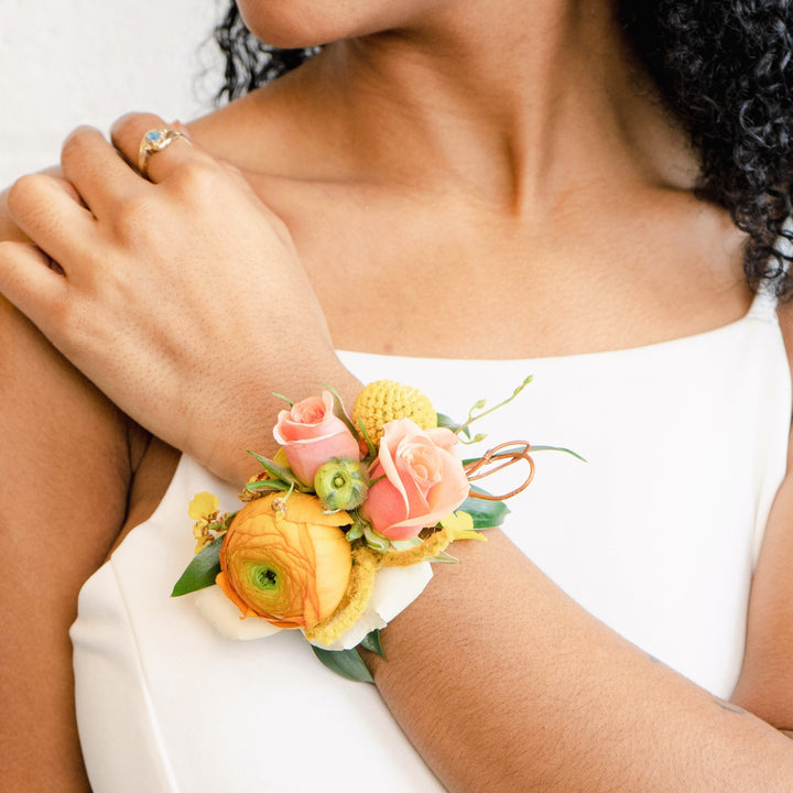Sunshine corsage in yellows and corals wedding florist rochester ny