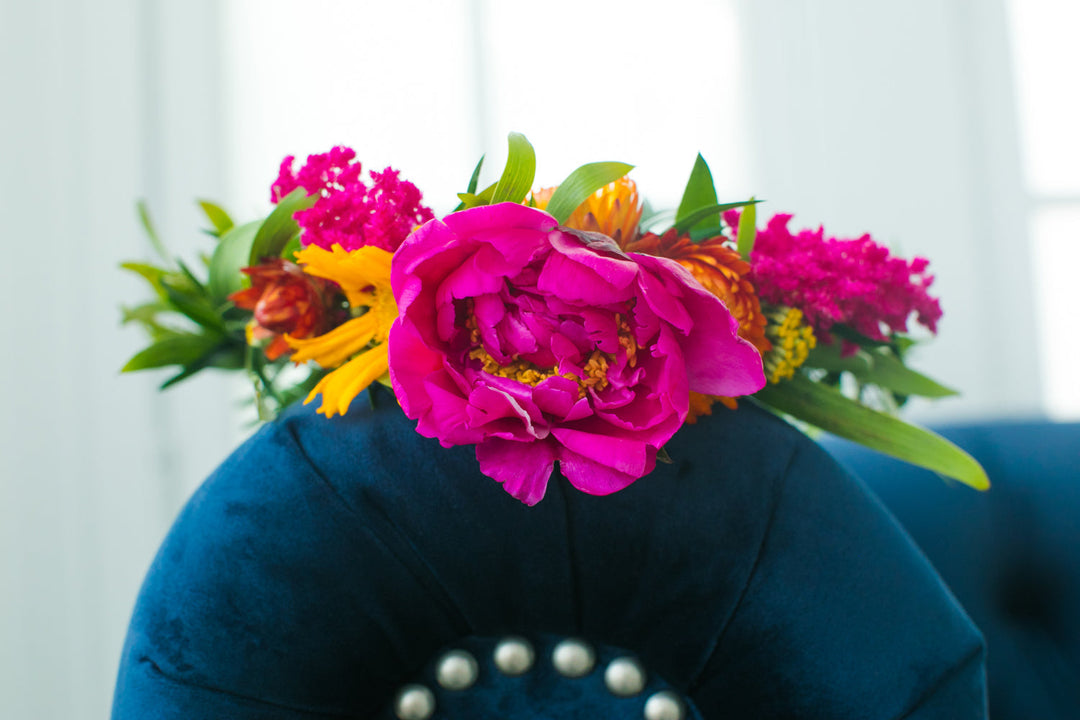colorful flower crown on arm of sofa 