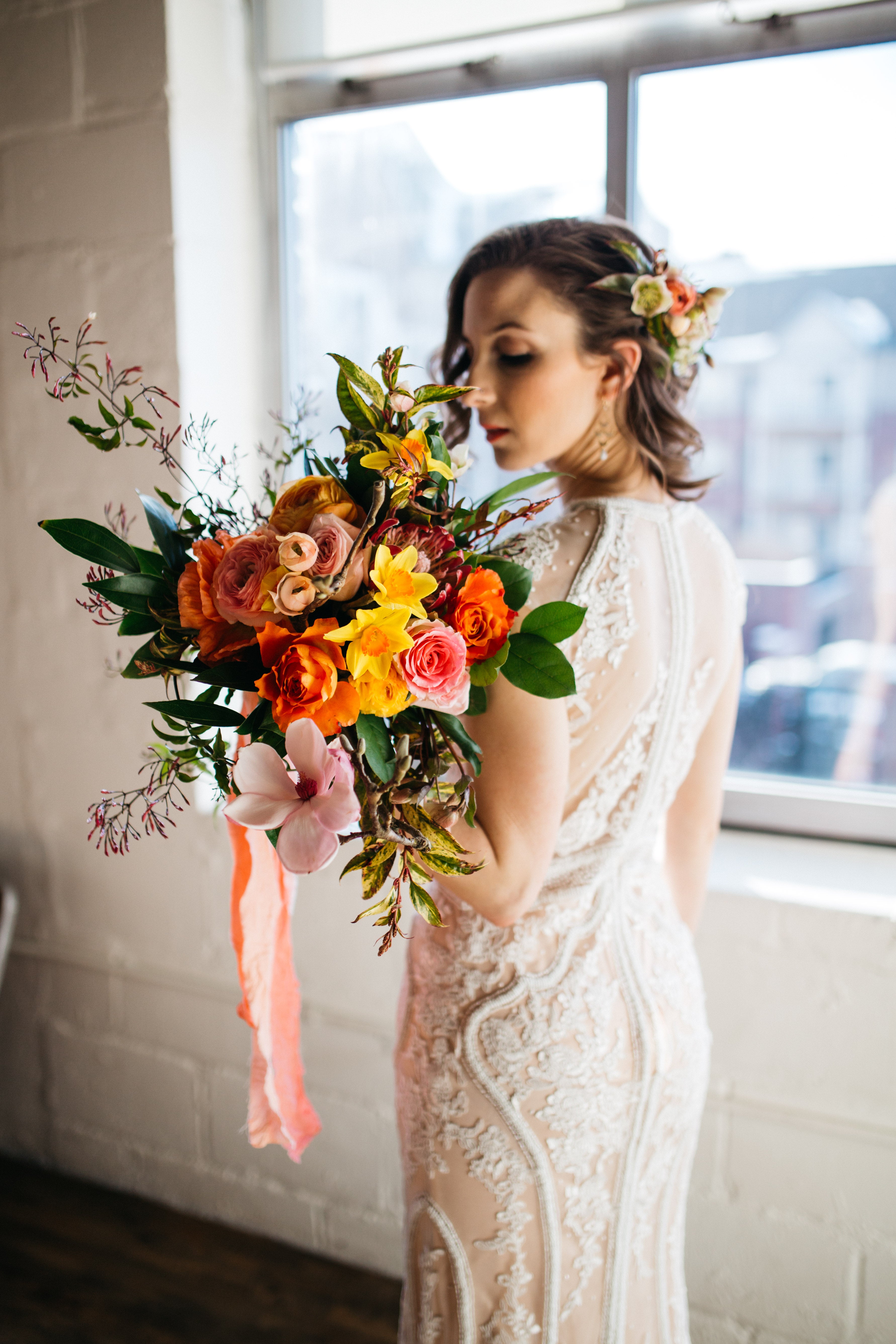 bride holding bright bridal bouquet