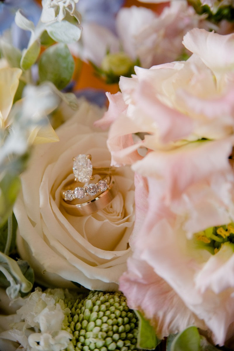 Ring on a bouquet of flowers with a soft focus background
