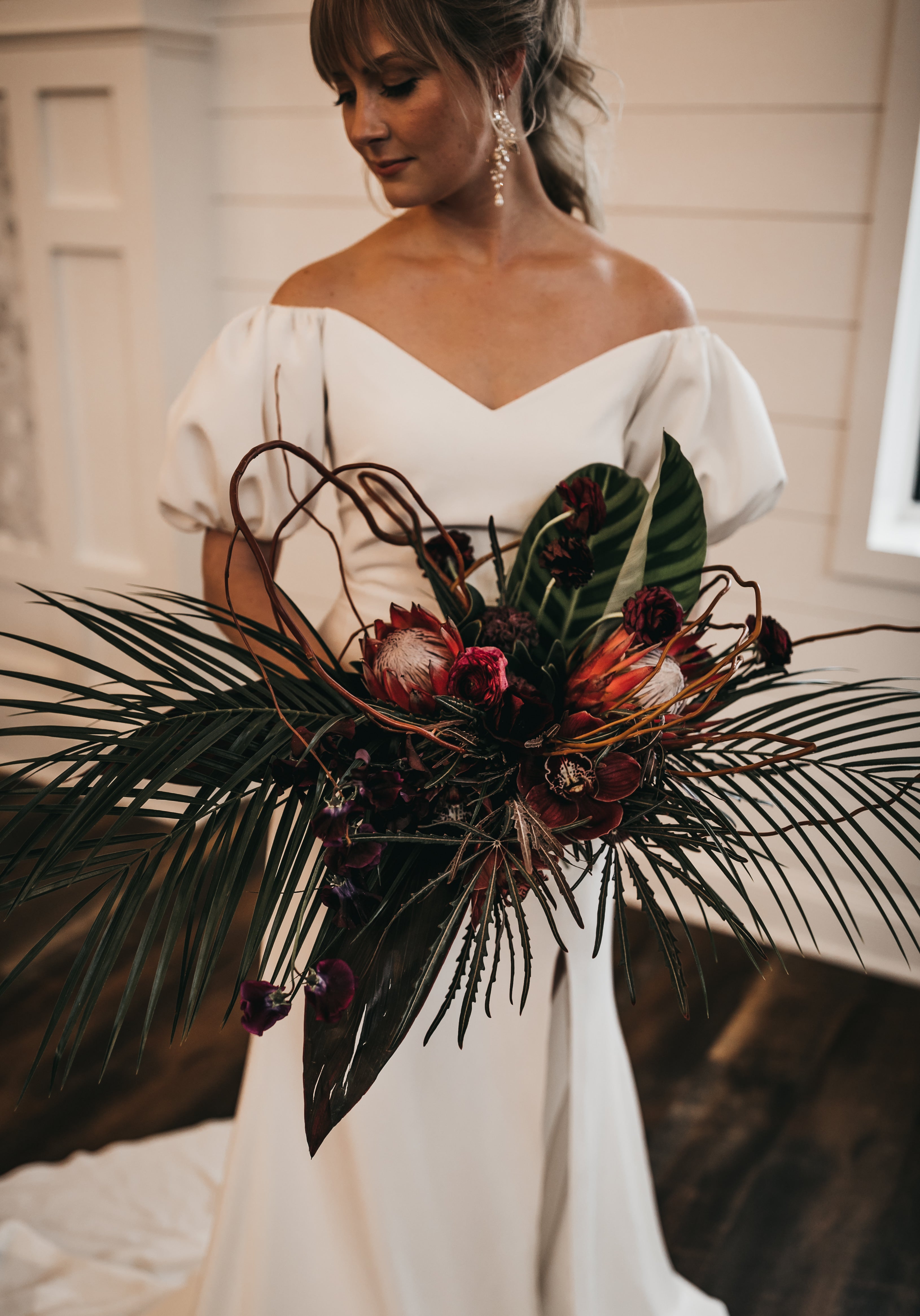 bride holding large bridal bouquet