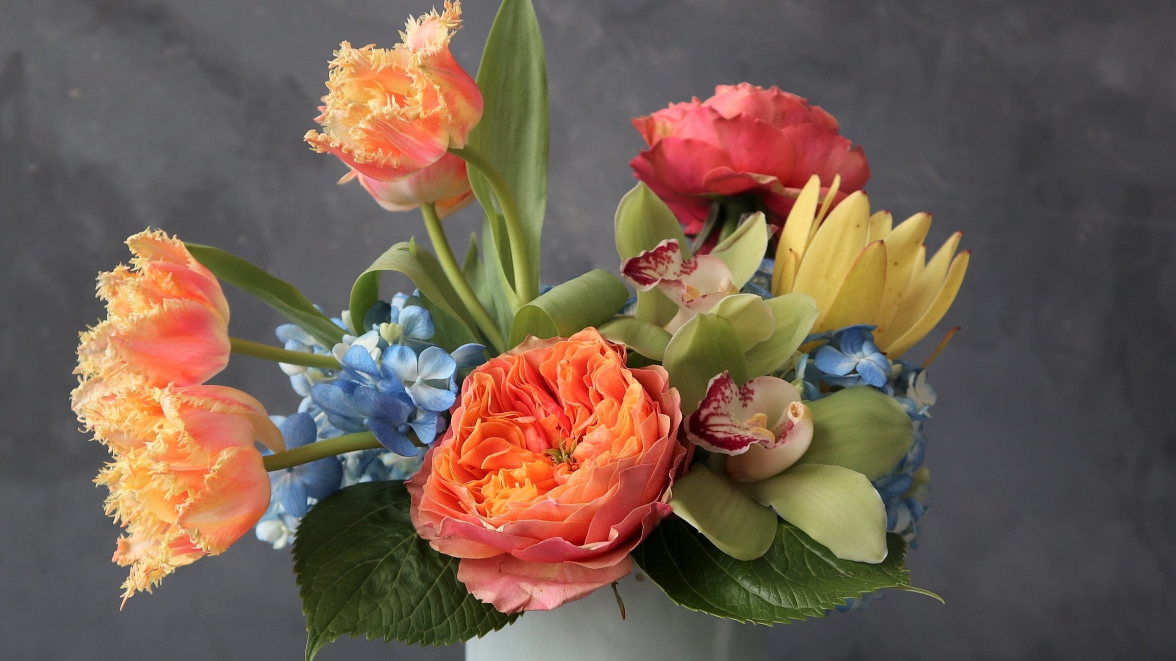 blue orange and green floral arrangements 