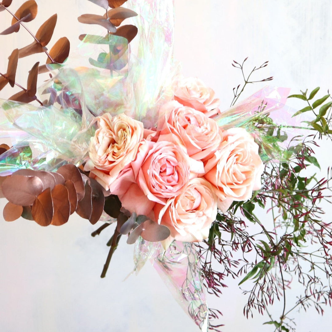 Iridescent Roses with peach roses, jasmine and iridescent paper