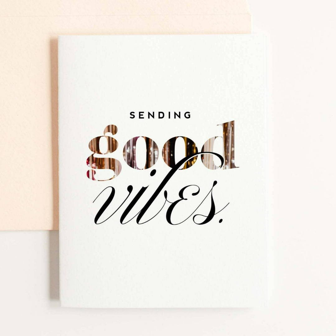 A simple white card with text that reads "Sending good vibes.".