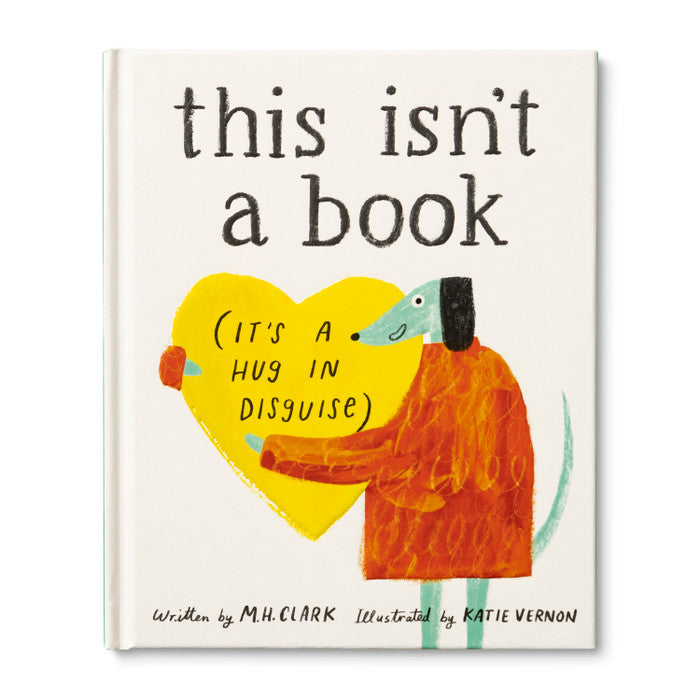 This isn't a Book (It's a Hug in Disguise) | Compendium | A cream book with a dog holding a heart. "this isn't a book (It's a hug in disguise)" "Written by M.H. Clark, Illustrated by Katie Vernon".