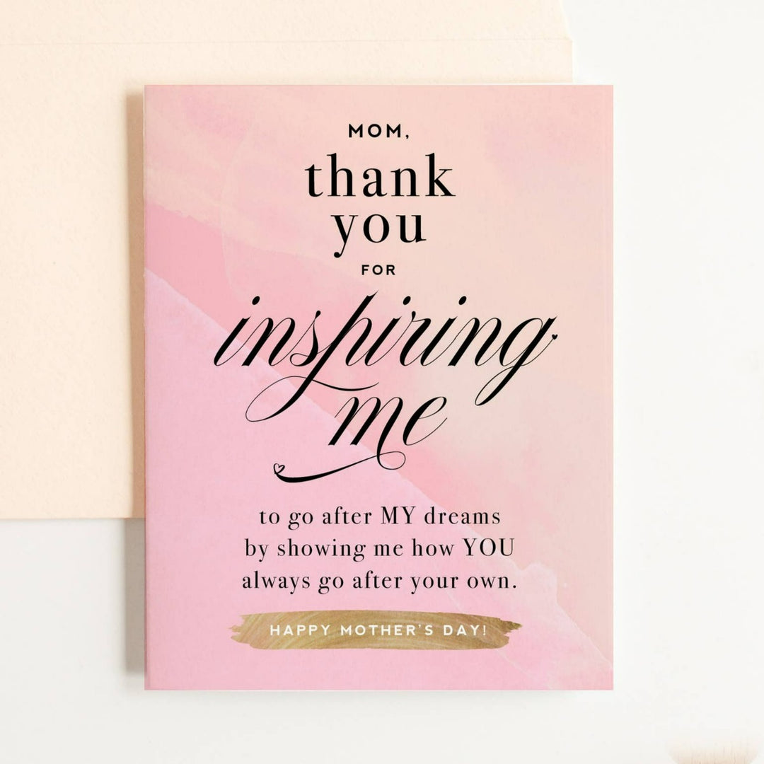 A light pink card with black text that reads "Mom, thank you for inspiring me to go after MY dreams by showing me how YOU always go after your own. Happy Mother's Day!"