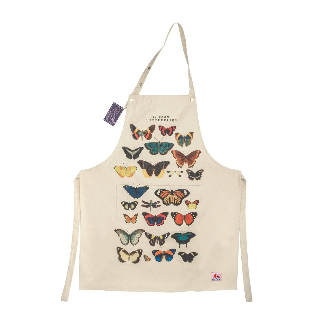 123 Farm | Beige apron with colorful butterfly designs on a white background