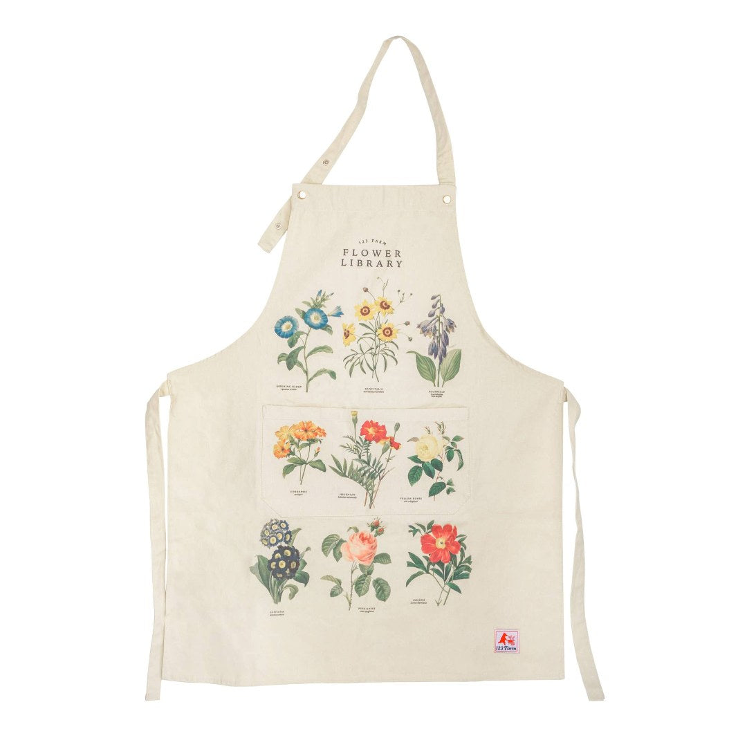 123 Farm | Flower Library | Beige apron with floral illustrations.