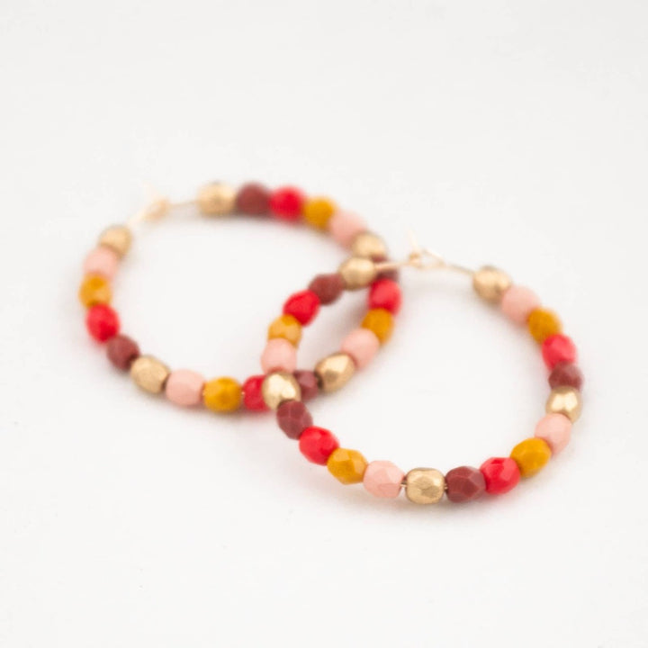 Nest Pretty Things | Red and Gold Hoops | A set of colorful beaded hoop earrings.