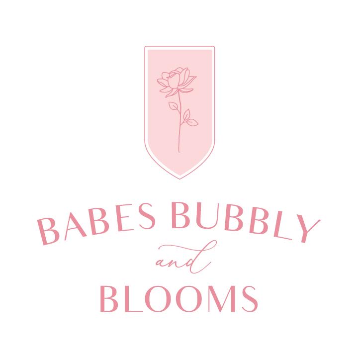 Babes Bubbly and Blooms in pink with a flower.